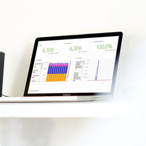 success story main image of charts on a laptop screen